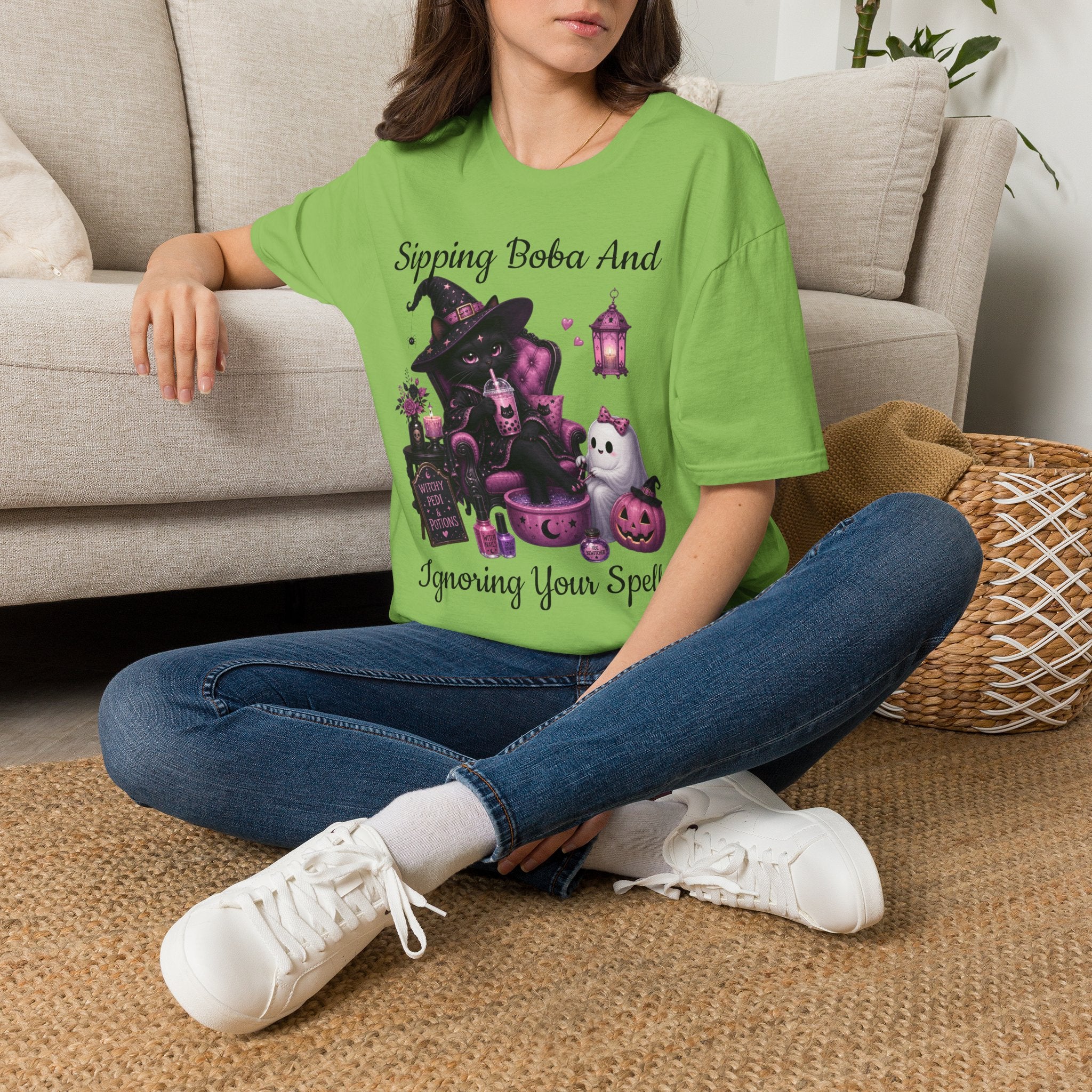 Witch Cat Graphic T-Shirt — Cute Halloween Cat with Lantern & Pumpkin
